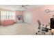 A bedroom with pink walls, a ceiling fan, and a closet at 12131 Ne 10Th Ter, Ocala, FL 34479