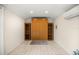 Bonus room featuring built-in shelving, large closet, and mini-split system for personalized comfort at 12131 Ne 10Th Ter, Ocala, FL 34479