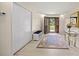 Inviting foyer with a wooden front door, coat closet, and elegant decor creates a warm welcome at 12131 Ne 10Th Ter, Ocala, FL 34479