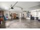 Spacious garage interior featuring ample storage, shelving, and well-organized utility systems at 12131 Ne 10Th Ter, Ocala, FL 34479