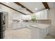 Bright modern kitchen featuring white cabinetry, stainless appliances, and stylish countertops at 12131 Ne 10Th Ter, Ocala, FL 34479