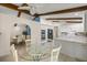 Open kitchen and breakfast nook area with modern appliances, white cabinets and sleek countertops at 12131 Ne 10Th Ter, Ocala, FL 34479