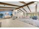 Expansive great room featuring vaulted ceilings, an open dining area, and abundant natural light at 12131 Ne 10Th Ter, Ocala, FL 34479