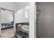 Modern bathroom with a bathtub, gray tiled shower and access to main bedroom at 12320 Sw 62Nd Pl, Ocala, FL 34481