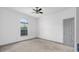 Bedroom has neutral carpet, a window, and two electrical outlets at 12320 Sw 62Nd Pl, Ocala, FL 34481