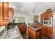 Bright kitchen featuring a central island and dark countertops with nice stainless appliances at 12320 Sw 62Nd Pl, Ocala, FL 34481