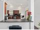An open kitchen featuring granite countertops and a breakfast bar at 12320 Sw 62Nd Pl, Ocala, FL 34481