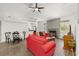 Spacious living room with tile floors, a dining area, and a cozy fireplace for comfortable living at 12320 Sw 62Nd Pl, Ocala, FL 34481