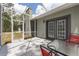 Screened patio with table, chairs and view of the home's backyard at 12320 Sw 62Nd Pl, Ocala, FL 34481