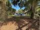 Charming single-story home surrounded by mature trees and lush landscaping at 14 Count Fleet Dr, Ocala, FL 34482