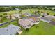 Aerial view showcases well-maintained homes, lush landscaping, and a beautiful golf course community at 15549 Sw 11Th Terrace Rd, Ocala, FL 34473
