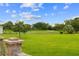 Lush backyard overlooking the golf course offers serene views and ample space for outdoor activities and landscaping at 15549 Sw 11Th Terrace Rd, Ocala, FL 34473