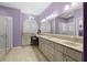 Large bathroom with double vanity, custom cabinets, a large mirror, and ample counter space at 15549 Sw 11Th Terrace Rd, Ocala, FL 34473