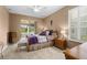 Comfortable bedroom with neutral paint, tile floors, ample natural light, and elegant decor at 15549 Sw 11Th Terrace Rd, Ocala, FL 34473
