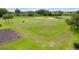 Scenic view of the lush green golf course with golfers enjoying a round on a sunny day at 15549 Sw 11Th Terrace Rd, Ocala, FL 34473