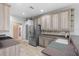 Bright kitchen featuring stainless steel appliances, tiled backsplash, custom cabinets, and pantry access at 15549 Sw 11Th Terrace Rd, Ocala, FL 34473