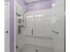 Glass-enclosed shower featuring a built-in bench, dual shower heads, and a modern design at 15549 Sw 11Th Terrace Rd, Ocala, FL 34473