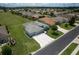 An aerial view highlights this home's driveway, landscaping and position within the neighborhood at 16215 Sw 15Th Ct, Ocala, FL 34473