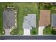 An aerial view of a single Gathering home featuring a well-manicured lawn at 16215 Sw 15Th Ct, Ocala, FL 34473
