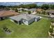 Aerial view displaying the home's large backyard, patio, mature landscaping, and neighborhood location at 16215 Sw 15Th Ct, Ocala, FL 34473
