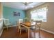 Dining room with seating for six features a ceiling fan and natural light at 16215 Sw 15Th Ct, Ocala, FL 34473