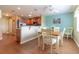 Open concept layout shows the kitchen and dining room areas with complementary paint colors and decor at 16215 Sw 15Th Ct, Ocala, FL 34473