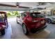 Spacious three car garage with high ceilings, and plenty of room for vehicles and storage at 16215 Sw 15Th Ct, Ocala, FL 34473