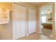 Hallway with access to bedroom with carpet floors and natural light at 16215 Sw 15Th Ct, Ocala, FL 34473