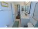 Cozy bathroom features a modern vanity with new fixtures and a tile floor at 17034 Florence View Dr, Montverde, FL 34756
