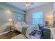 Inviting bedroom with a full size bed, neutral decor, and a dedicated workspace at 17034 Florence View Dr, Montverde, FL 34756