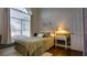 Bright bedroom with large window, accent wall, and decorative touches at 17034 Florence View Dr, Montverde, FL 34756