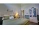 Guest bedroom with green accent wall, large window, and closet at 17034 Florence View Dr, Montverde, FL 34756
