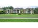 Charming one-story home featuring a large, well-manicured front lawn and beautiful, mature landscaping at 17034 Florence View Dr, Montverde, FL 34756