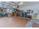 Large, organized two-car garage with shelving and storage solutions for tools and equipment at 17034 Florence View Dr, Montverde, FL 34756