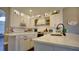 Bright, white kitchen with updated appliances, ample counter space, and a modern sink at 17034 Florence View Dr, Montverde, FL 34756