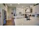 Spacious kitchen featuring stainless steel appliances, white cabinets, and an open design at 17034 Florence View Dr, Montverde, FL 34756