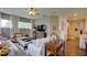 Cozy living room with neutral tones, plush seating, and a seamless transition to the kitchen at 17034 Florence View Dr, Montverde, FL 34756