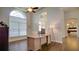 Spacious office featuring high ceilings, arched windows, and light wood desk at 17034 Florence View Dr, Montverde, FL 34756