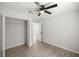 Bedroom featuring a ceiling fan, wood-look flooring, and closet at 1708 Nw 27Th Ave, Ocala, FL 34475