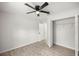 Bedroom with a ceiling fan and wood-look flooring at 1708 Nw 27Th Ave, Ocala, FL 34475