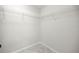 Walk-in closet featuring wire shelving and marble-look tile at 1708 Nw 27Th Ave, Ocala, FL 34475