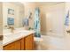 Bathroom featuring a shower/tub combo, a wood vanity, and tile floors at 1768 Sw 156Th Ln, Ocala, FL 34473