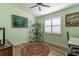Bedroom featuring green paint, a window with shutters, and a round rug at 1768 Sw 156Th Ln, Ocala, FL 34473