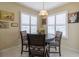 Charming breakfast nook with round table, shuttered windows, and decorative art at 1768 Sw 156Th Ln, Ocala, FL 34473