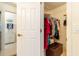 Walk-in closet featuring a wire shelving system, rod for hanging clothes, and a brown ottoman at 1768 Sw 156Th Ln, Ocala, FL 34473