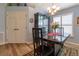 Stylish dining area with modern furnishings, a black china cabinet, and natural lighting at 1768 Sw 156Th Ln, Ocala, FL 34473
