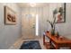 Bright foyer features tile flooring, a console table, and decorative artwork at 1768 Sw 156Th Ln, Ocala, FL 34473