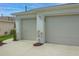 Garage with two doors and an elegant white trim at 1768 Sw 156Th Ln, Ocala, FL 34473