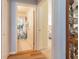 Hallway with wood floors leading to a bathroom and a bedroom at 1768 Sw 156Th Ln, Ocala, FL 34473