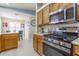 Spacious kitchen showcases stainless steel appliances and gas range at 1768 Sw 156Th Ln, Ocala, FL 34473